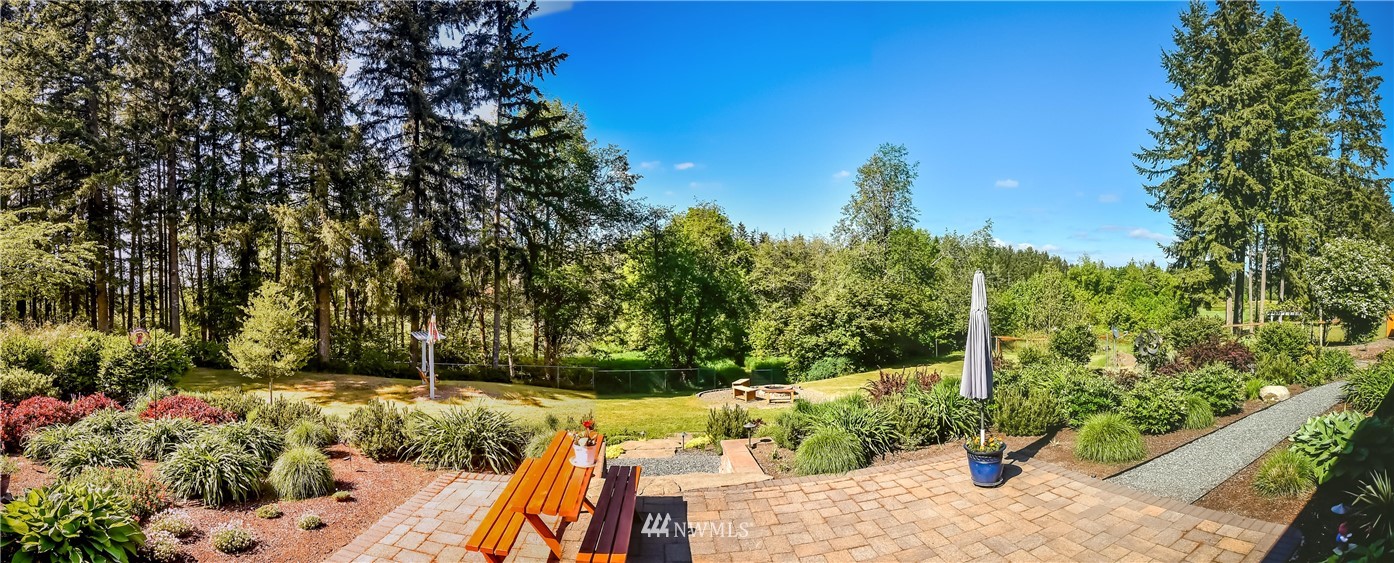 5124 133rd Avenue Southwest Rochester, WA 98579 - Photo 34 of 36 a view of a backyard with sitting area