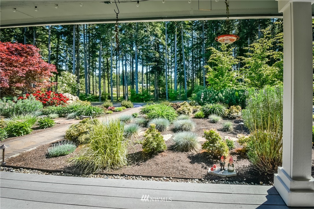 5124 133rd Avenue Southwest Rochester, WA 98579 - Photo 8 of 36 a view of a garden from a window