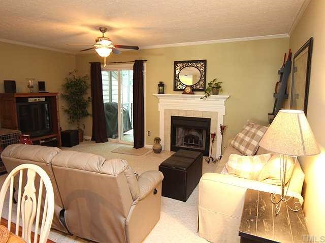 605 Broad Leaf Circle Raleigh, NC 27613 - Photo 3 of 12 a living room with a couch and a fireplace