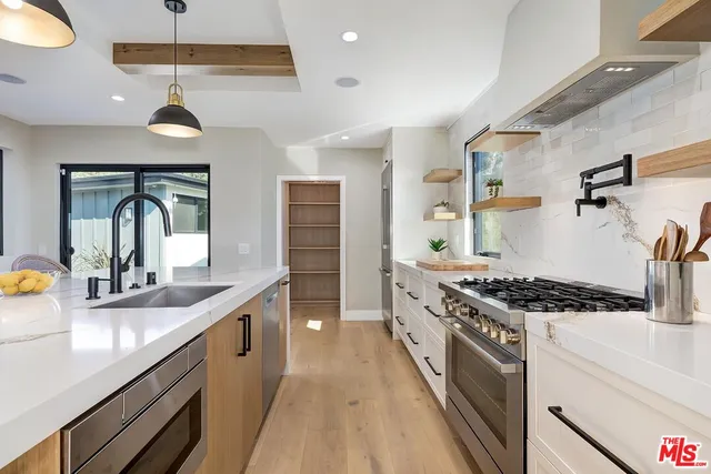 a very nice looking kitchen with a large window