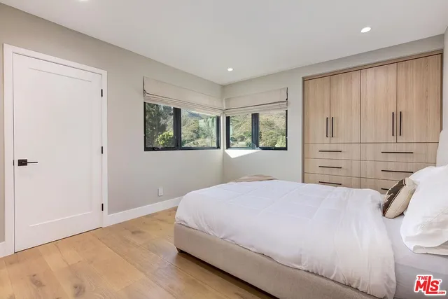 a bathroom with a bathtub and a window