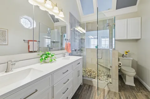 a spacious bedroom with a bed and large windows