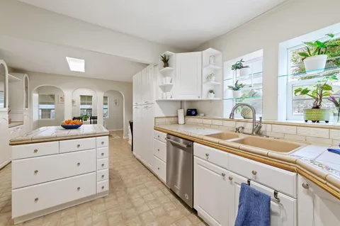 a view of a livingroom with furniture and a window
