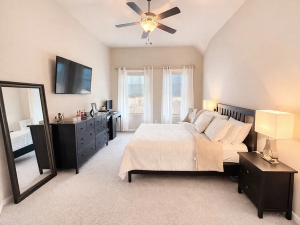 a spacious bathroom with a bathtub sink and mirror