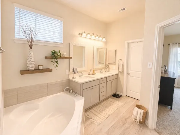 a bedroom with a bed and a table