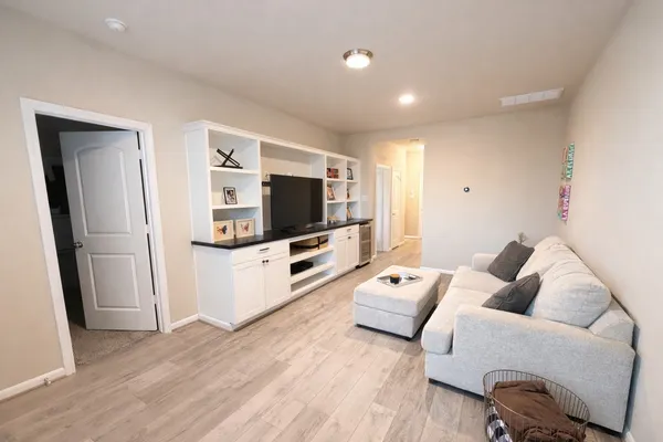 a view of a house with backyard porch and sitting area