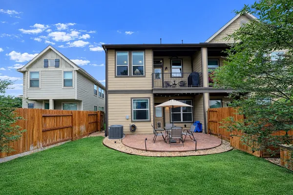 a view of a table and chairs under an umbrella