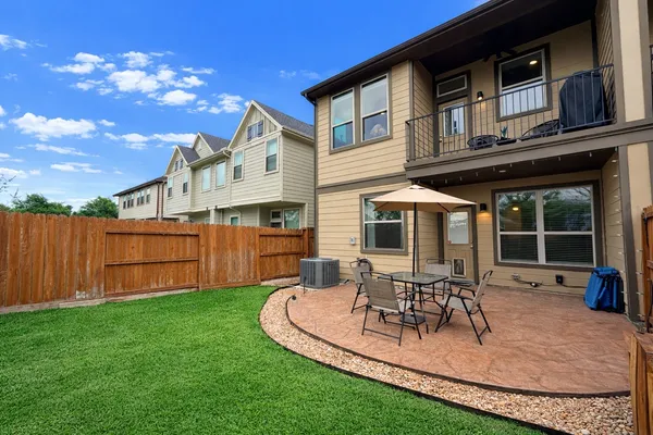 a view of a backyard with sitting area