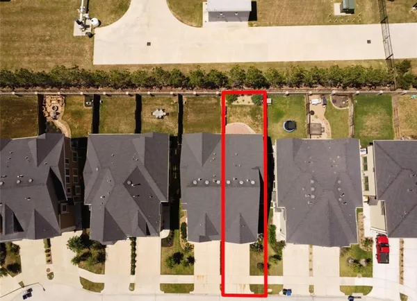 an aerial view of a houses with outdoor space and lake view