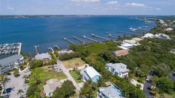 an aerial view of a house with a lake view