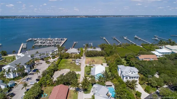 an aerial view of a house with a lake view
