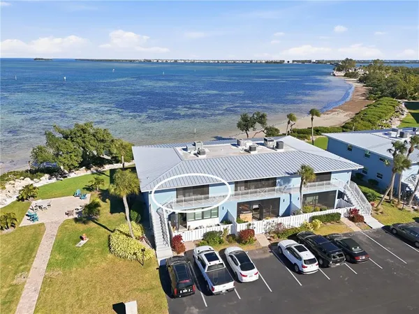 a aerial view of a house with swimming pool and furniture
