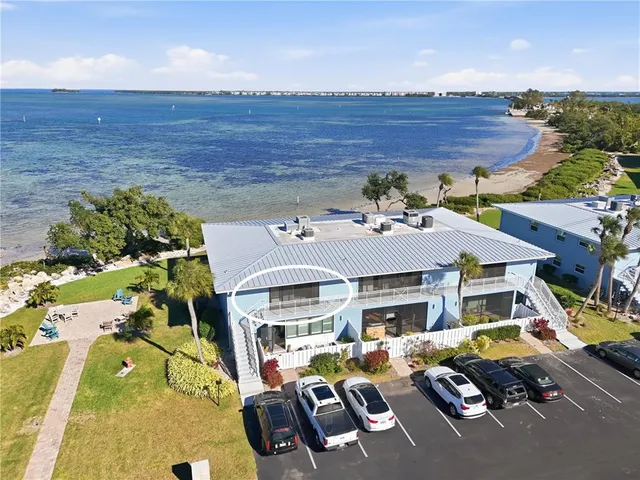 a aerial view of a house with swimming pool and furniture