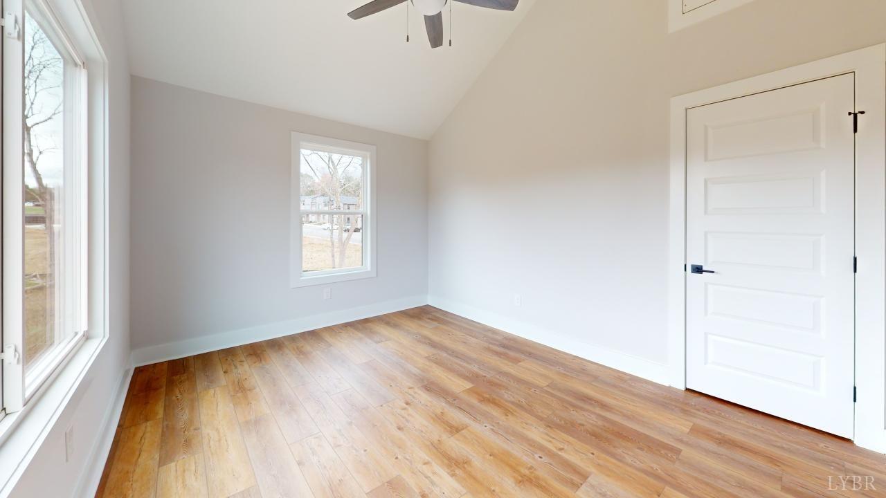 41 Shallen Road Rustburg, VA 24588 - Photo 32 of 46 an empty room with wooden floor cabinet and windows