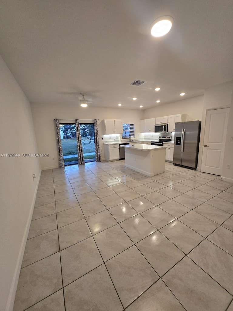6220 Northwest 19th Street Sunrise, FL 33313 - Photo 1 of 21 a kitchen with a sink and cabinets
