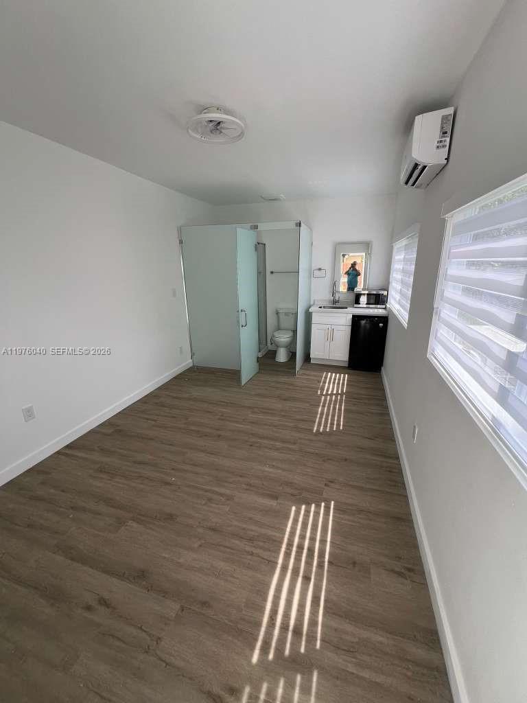 6220 Northwest 19th Street Sunrise, FL 33313 - Photo 14 of 21 a view of a bedroom with wooden floor