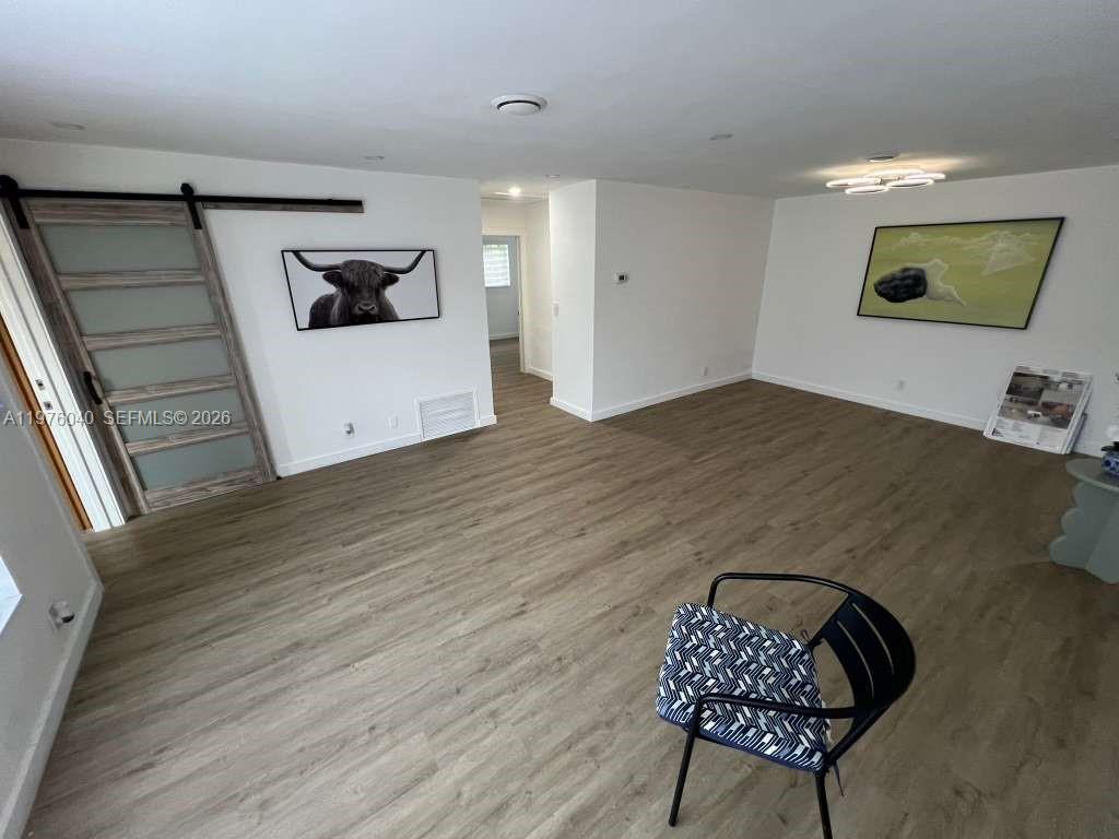 6220 Northwest 19th Street Sunrise, FL 33313 - Photo 15 of 21 a living room with furniture and a flat screen tv