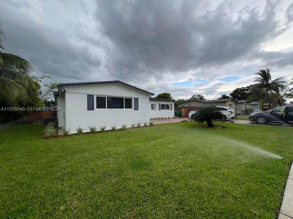 6220 Northwest 19th Street Sunrise, FL 33313 - Photo 16 of 21 a view of a house with backyard