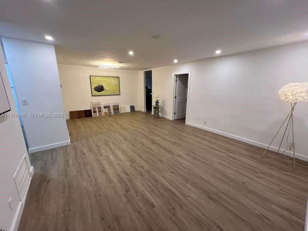 6220 Northwest 19th Street Sunrise, FL 33313 - Photo 19 of 21 an empty room with wooden floor and windows