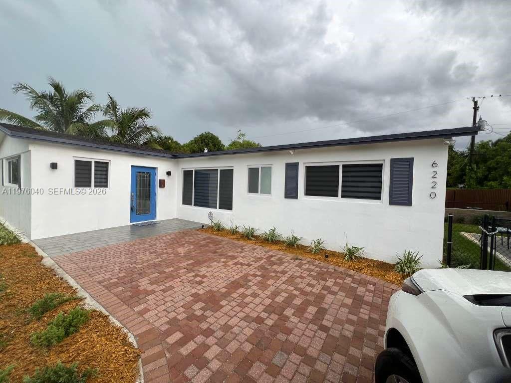 6220 Northwest 19th Street Sunrise, FL 33313 - Photo 3 of 21 a house view with a backyard space