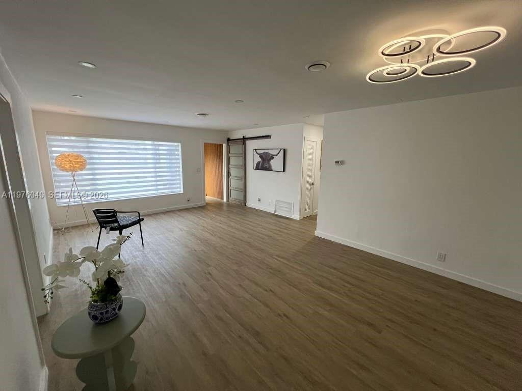 6220 Northwest 19th Street Sunrise, FL 33313 - Photo 7 of 21 a view of empty room with a window