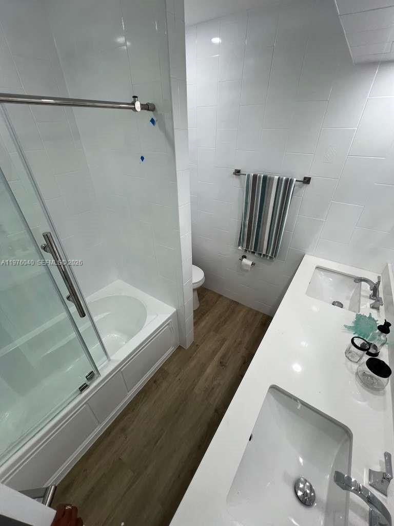 6220 Northwest 19th Street Sunrise, FL 33313 - Photo 9 of 21 a bathroom with a bathtub and shower