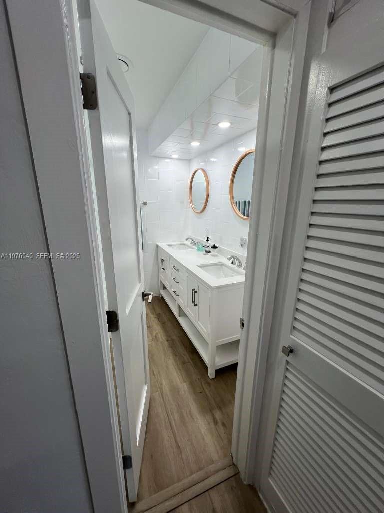 6220 Northwest 19th Street Sunrise, FL 33313 - Photo 10 of 21 a bathroom with a sink a mirror and vanity