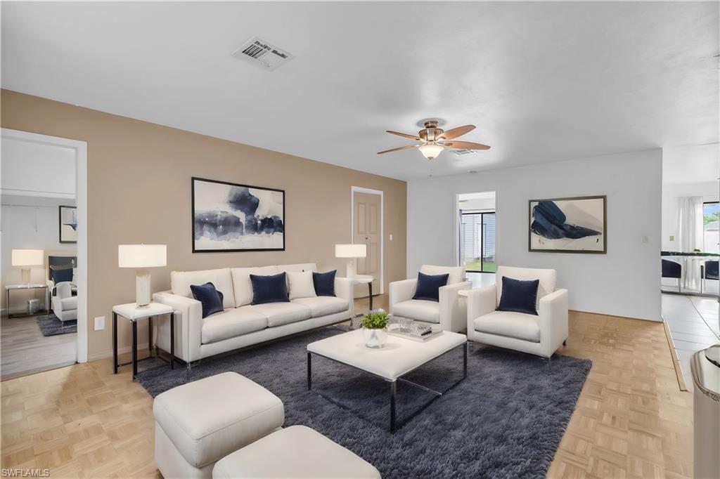 2264 53rd Street Southwest Naples, FL 34116 - Photo 1 of 40 Living room with a wealth of natural light, ceiling fan, and light parquet flooring