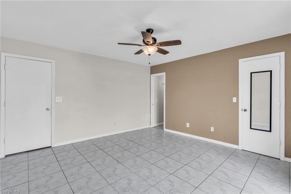 2264 53rd Street Southwest Naples, FL 34116 - Photo 19 of 40 Unfurnished room with ceiling fan