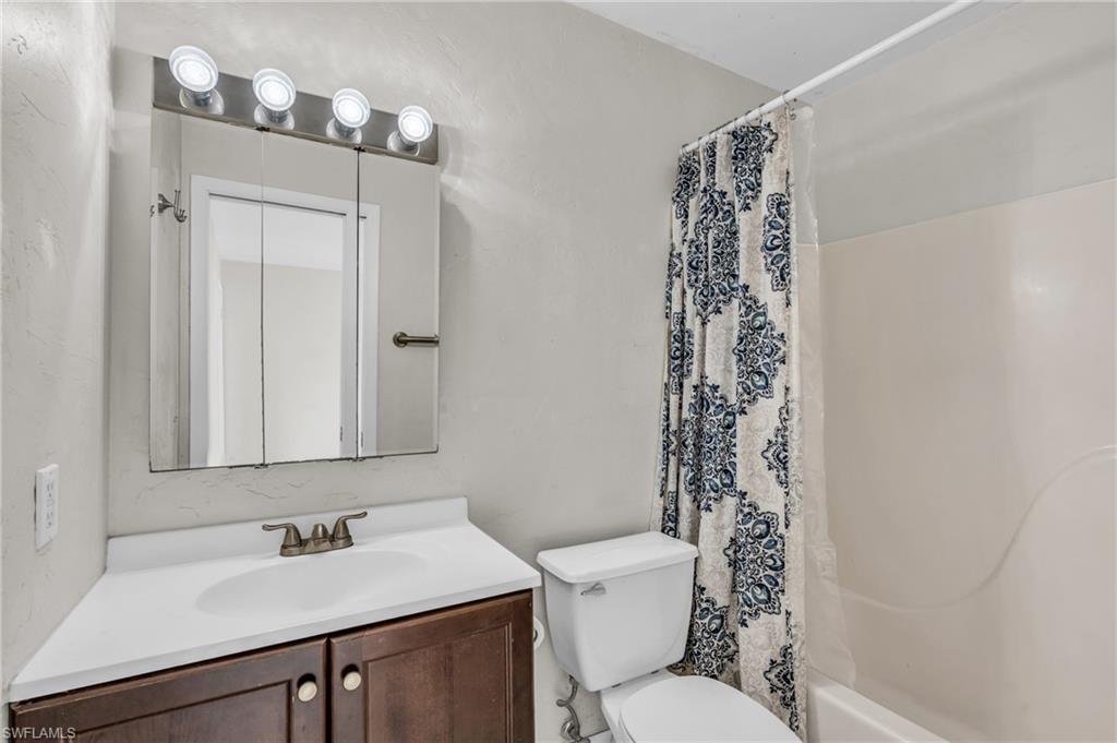 2264 53rd Street Southwest Naples, FL 34116 - Photo 21 of 40 Full bathroom with vanity, toilet, and shower / bath combo