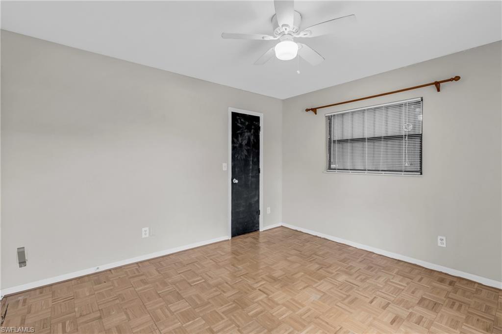 2264 53rd Street Southwest Naples, FL 34116 - Photo 25 of 40 Empty room featuring ceiling fan and light parquet floors