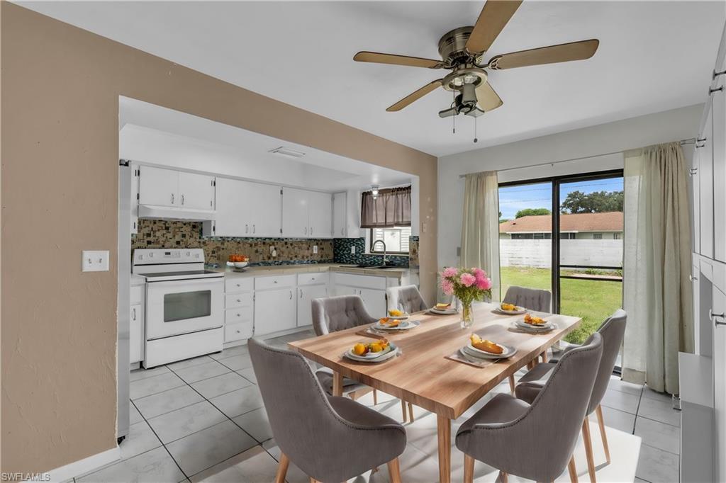 2264 53rd Street Southwest Naples, FL 34116 - Photo 3 of 40 Dining area with ceiling fan, sink, and light tile patterned flooring