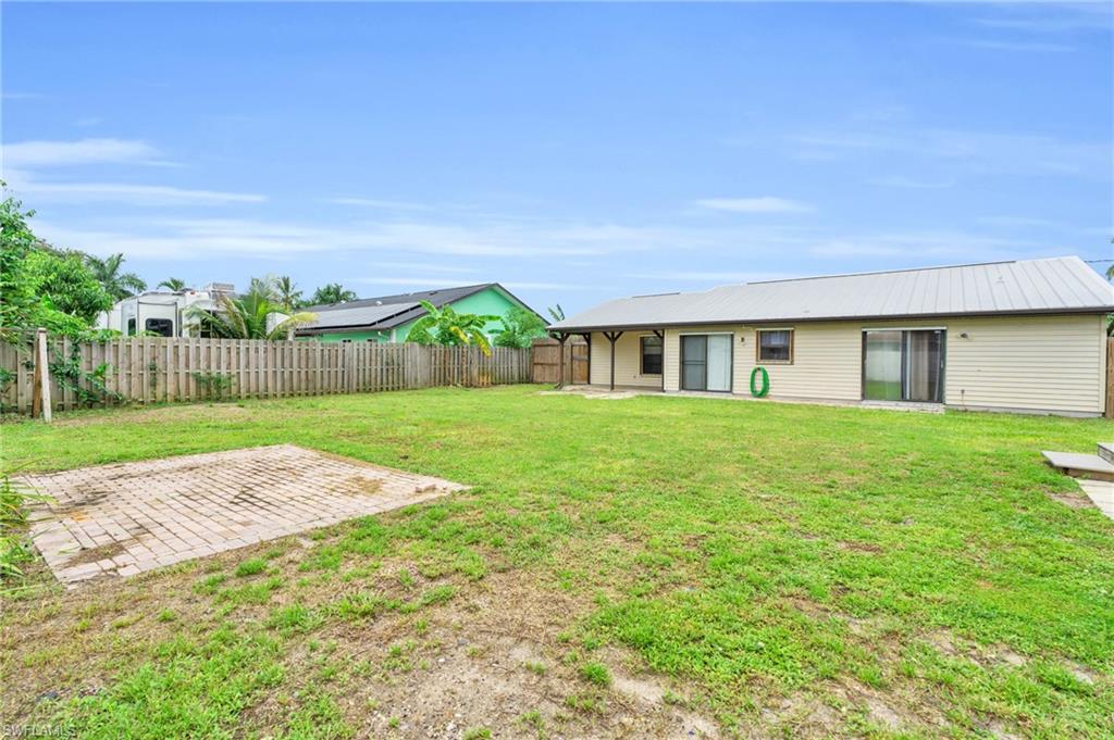 2264 53rd Street Southwest Naples, FL 34116 - Photo 33 of 40 View of yard featuring a patio area
