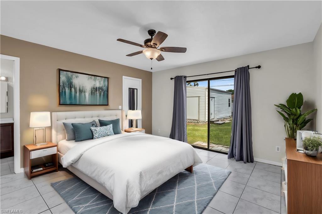 2264 53rd Street Southwest Naples, FL 34116 - Photo 4 of 40 Tiled bedroom featuring access to exterior and ceiling fan