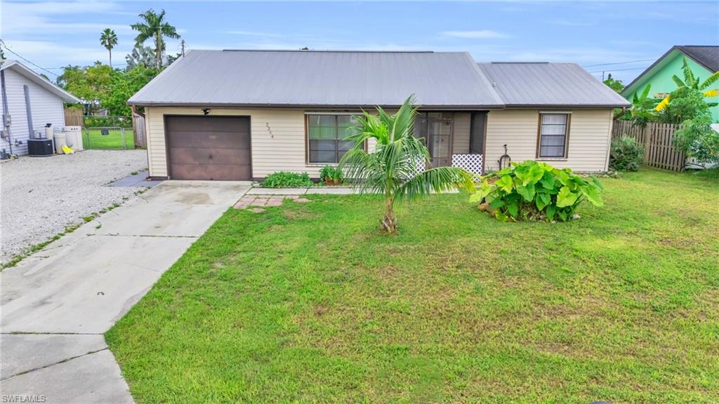 2264 53rd Street Southwest Naples, FL 34116 - Photo 8 of 40 Ranch-style home with a garage and a front lawn