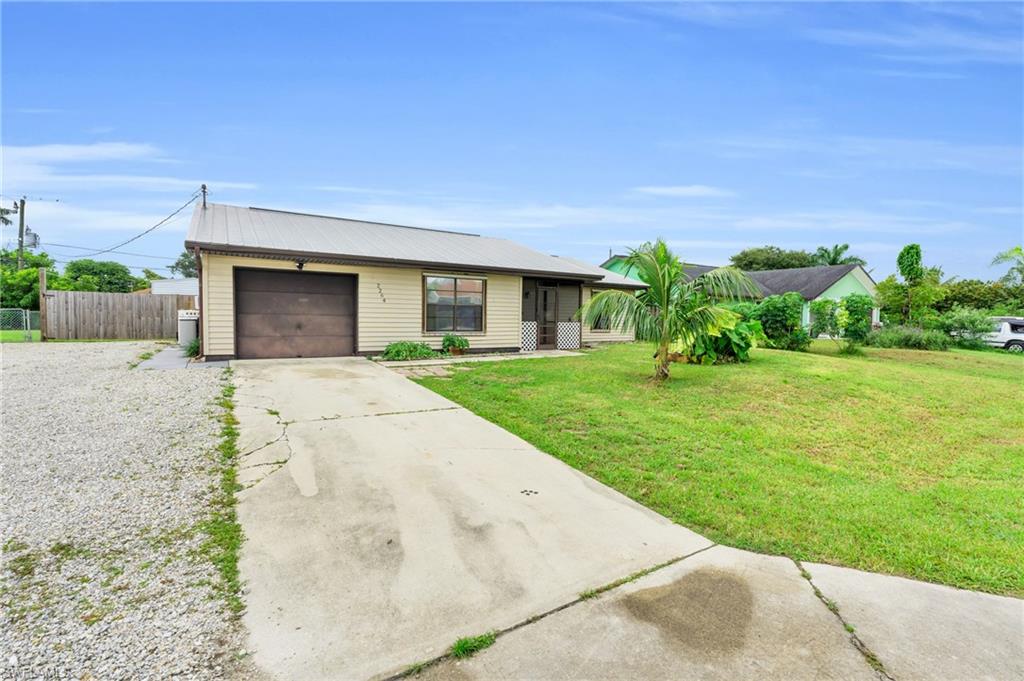 2264 53rd Street Southwest Naples, FL 34116 - Photo 9 of 40 Ranch-style house with a garage and a front yard