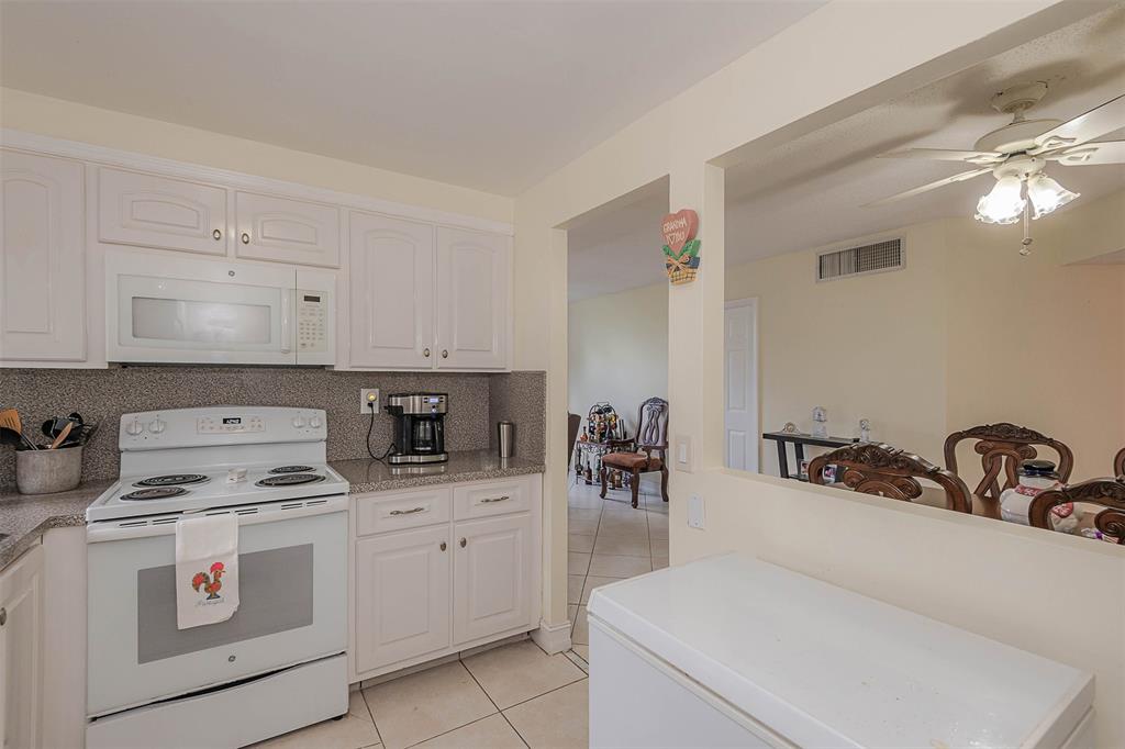 9351 Lime Bay Boulevard, Unit 207 Tamarac, FL 33321 - Photo 11 of 27 a room with storage and utility