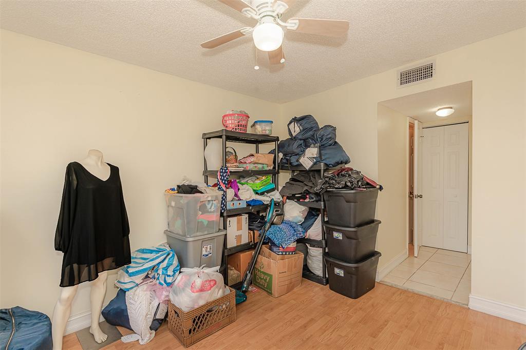 9351 Lime Bay Boulevard, Unit 207 Tamarac, FL 33321 - Photo 22 of 27 a view of a room with gym equipment