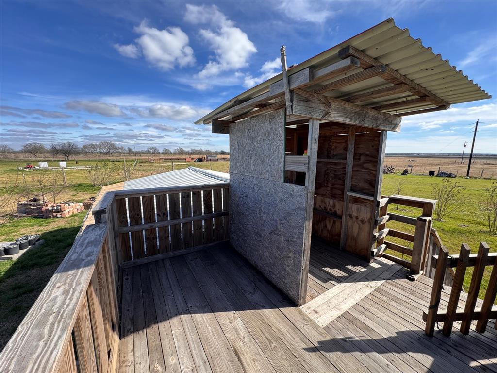 129 County Road 129 Marlin, TX 76661 - Photo 16 of 27 a view of balcony with wooden floor and outdoor seating