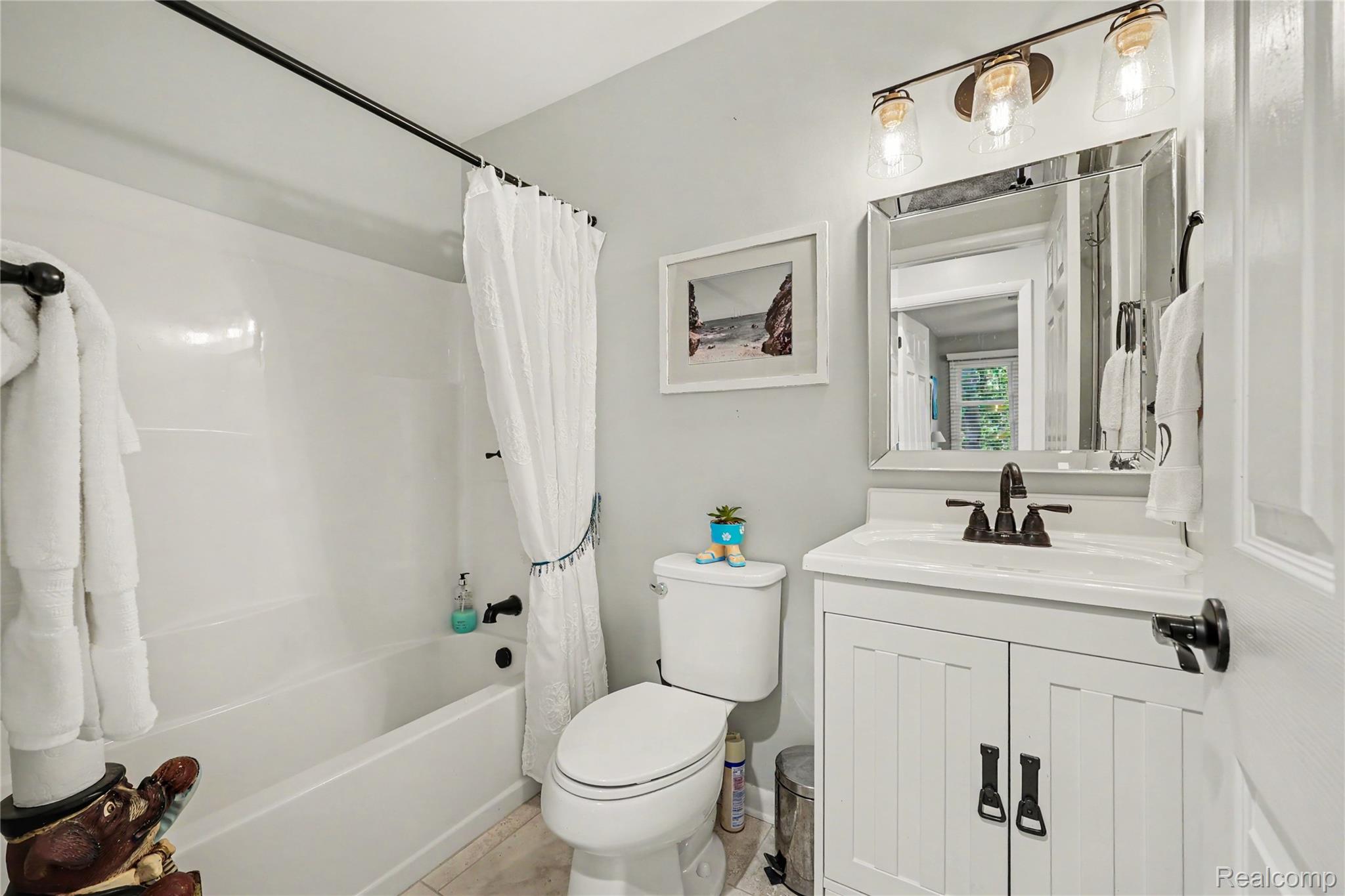 9031 East Lake Road, Unit 43 Clarkston, MI 48348 - Photo 16 of 19 Updated main bathroom