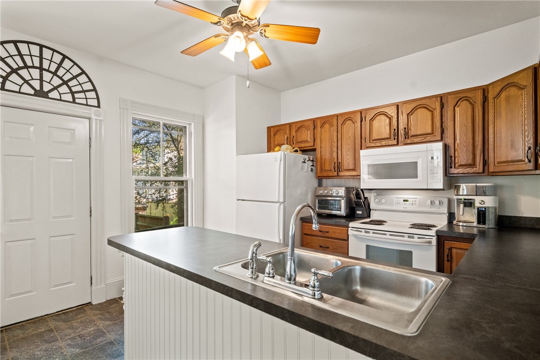 14 Greenough Place, Unit A Newport, RI 02840 - Photo 9 of 24 Kitchen with door leading to backyard/dining area.