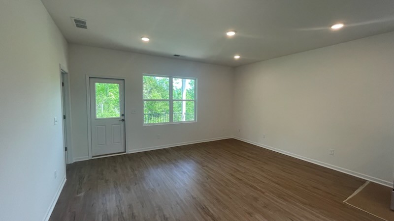 3244 Hearth Hollow Road Columbia, TN 38401 - Photo 4 of 32 an empty room with wooden floor and windows