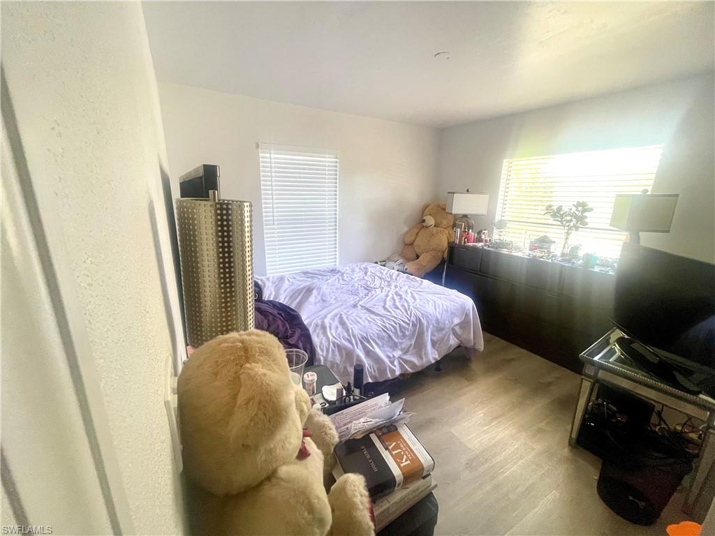 1339 5th Avenue North Naples, FL 34102 - Photo 10 of 17 Bedroom with wood finished floors
