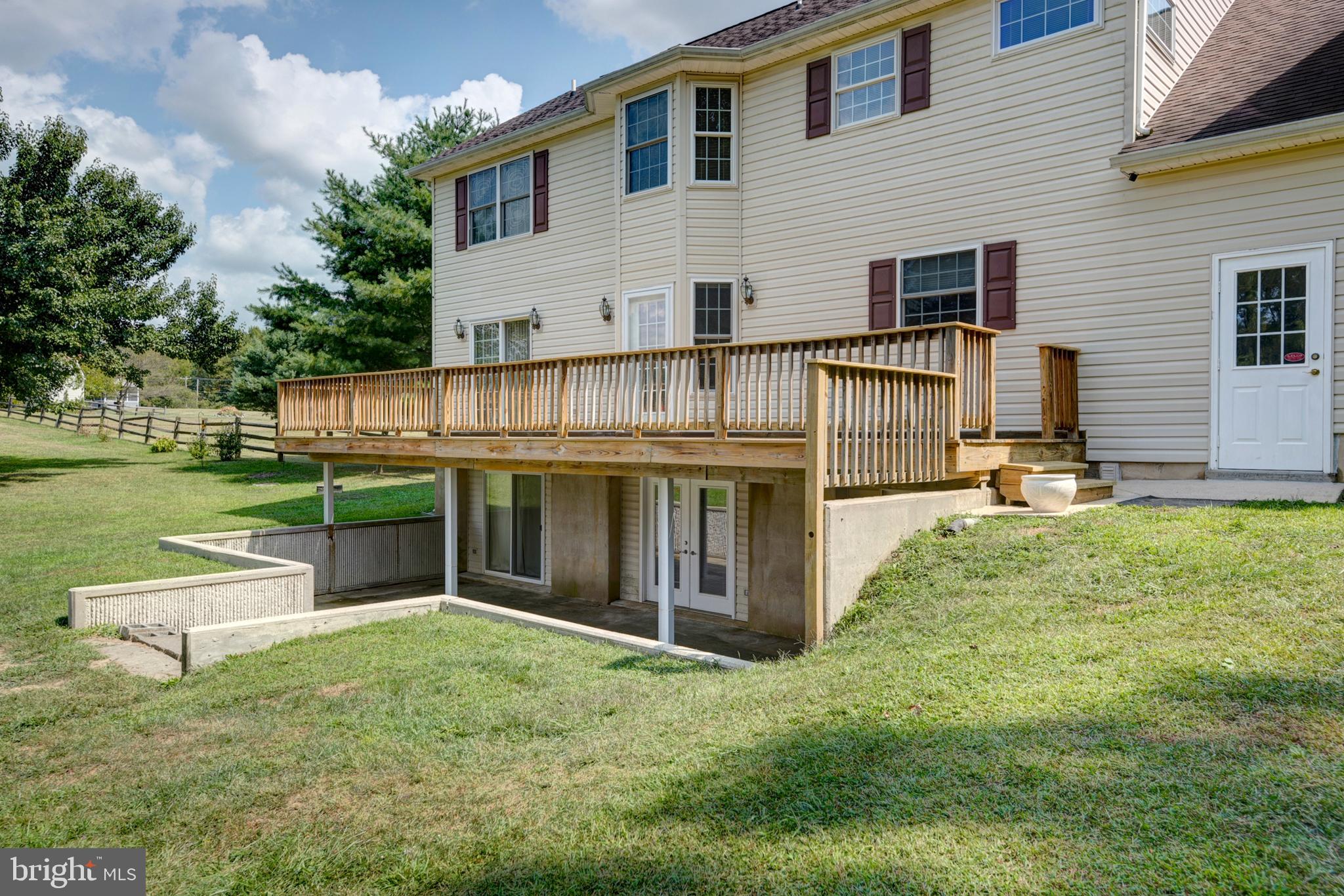 1879 Oldfield Point Road Elkton, MD 21921 - Photo 26 of 36 FULL PATIO BELOW DECK, MULTIPLE SLIDING DOORS