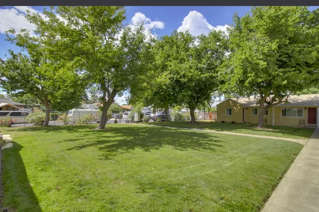 an aerial view of a houses with street