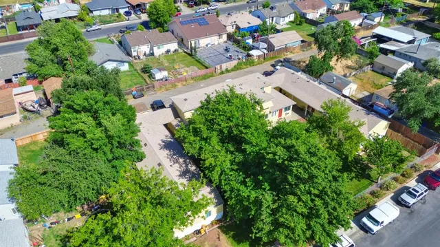 a front view of a house with trees