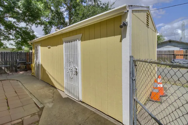 a bedroom with a bed and a ceiling fan