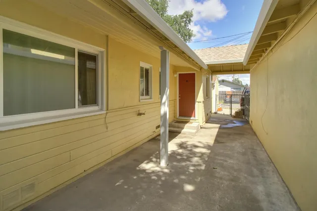 front view of a house with a garden