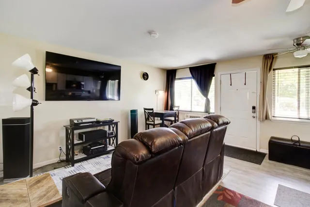 a kitchen with stainless steel appliances a stove microwave and cabinets