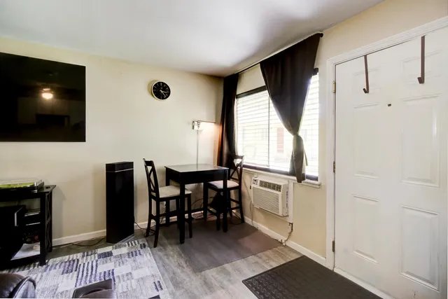 a kitchen with stainless steel appliances granite countertop a sink a stove cabinets counter space and a window